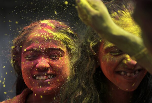 Indians gather for Holi celebrations as virus cases surge AP News